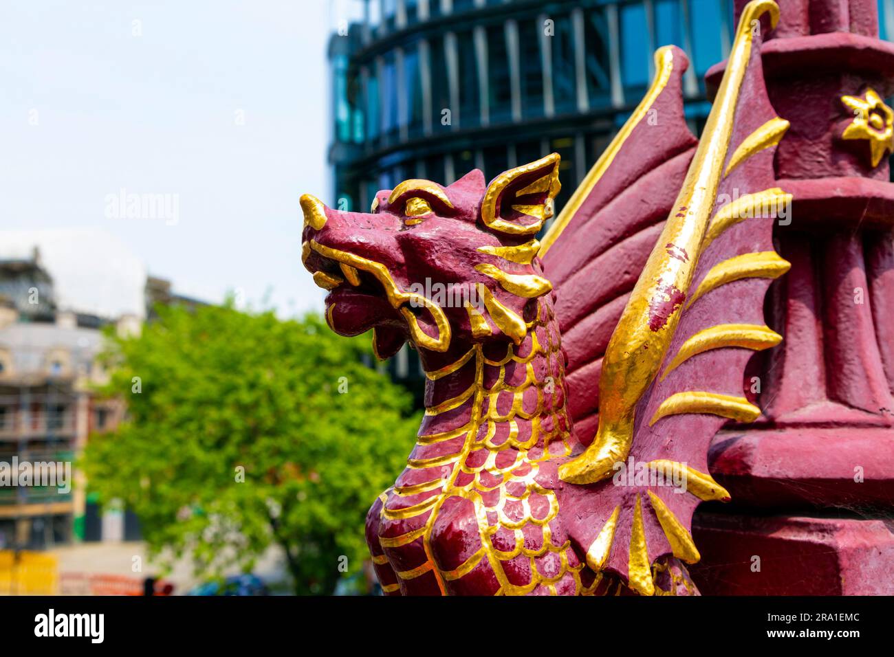 Red and gold dragon guarding a street lamp on the Holborn Viaduct, London, England, UK Stock Photo