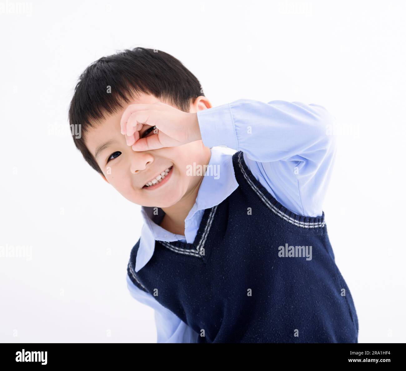 Happy child hand at forehead looking far away distance isolated on white background Stock Photo
