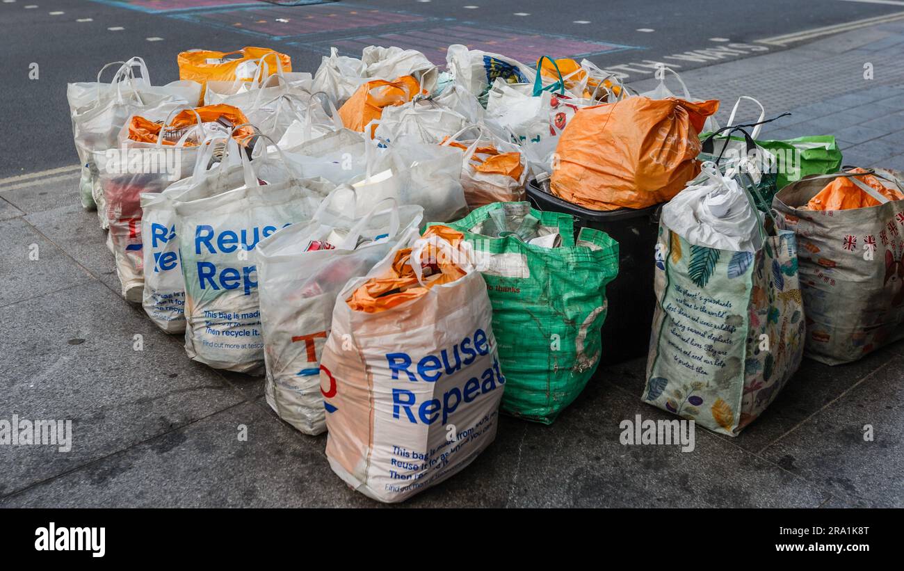 Bags of recyclables by the side of a road in London Stock Photo Alamy