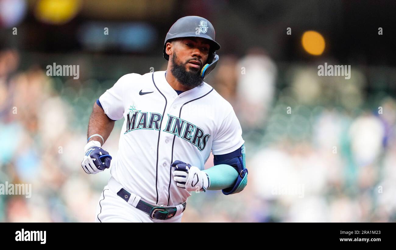 Seattle Mariners' Teoscar Hernandez tries to avoid being doused following a  15-2 win after a baseball game against the Kansas City Royals Saturday,  Aug. 26, 2023 in Seattle. (AP Photo/Lindsey Wasson Stock