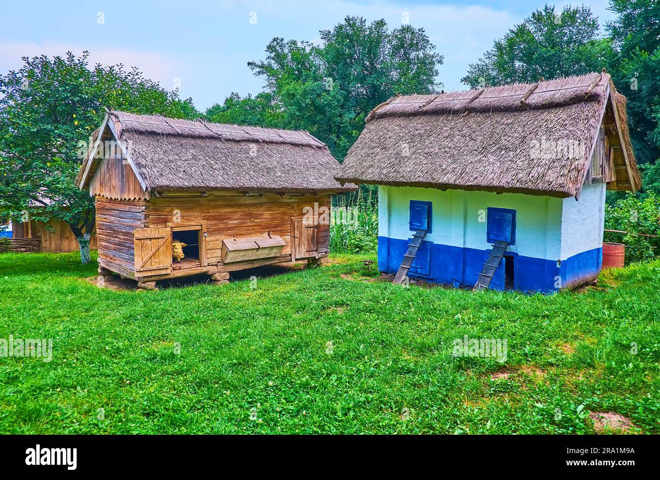 The green yard with old wooden and timber playpens of the farm in  Chernivtsi scansen, Ukraine Stock Photo - Alamy