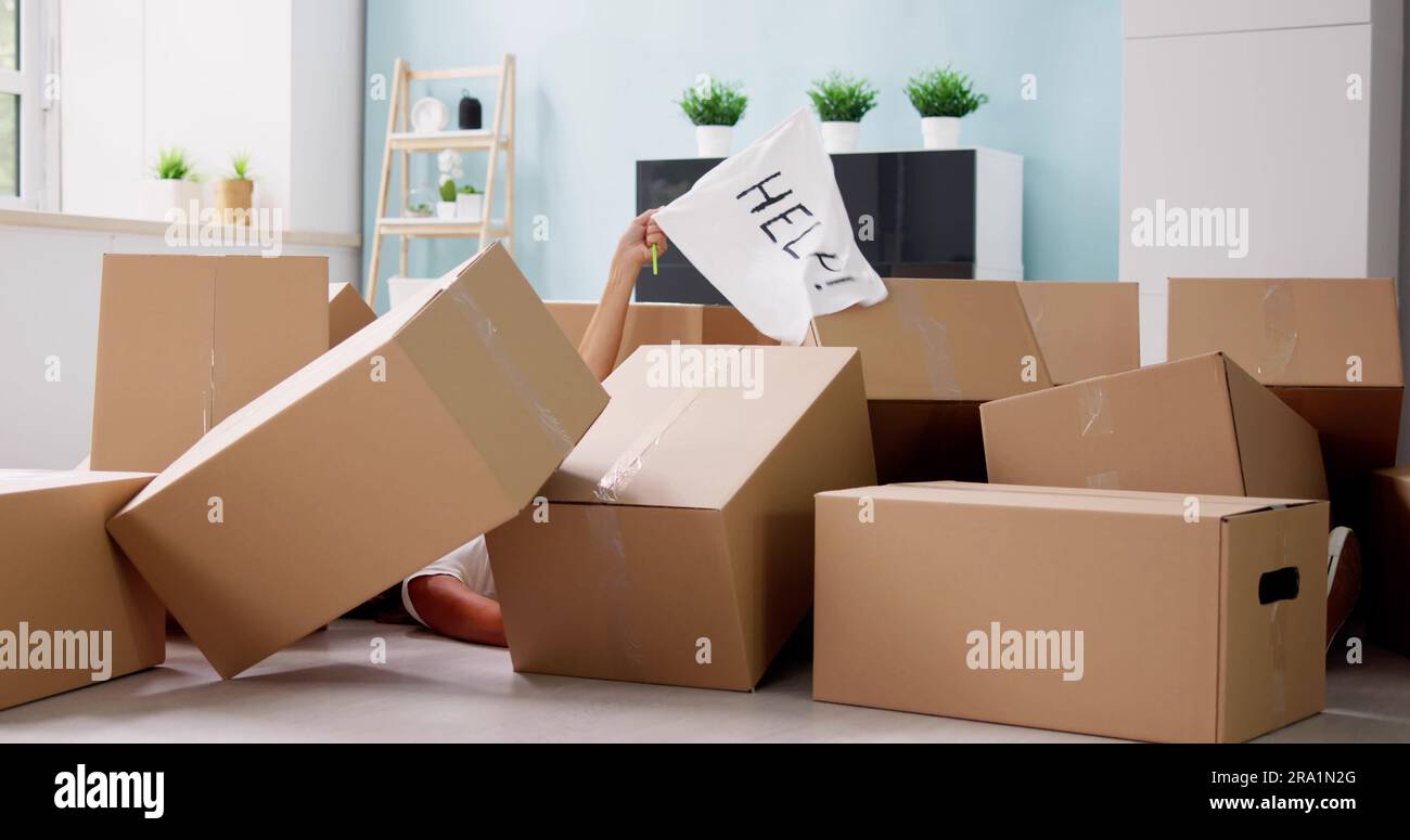 Funny Moving Accidents. Falling Cardboard Boxes At Home Stock Photo