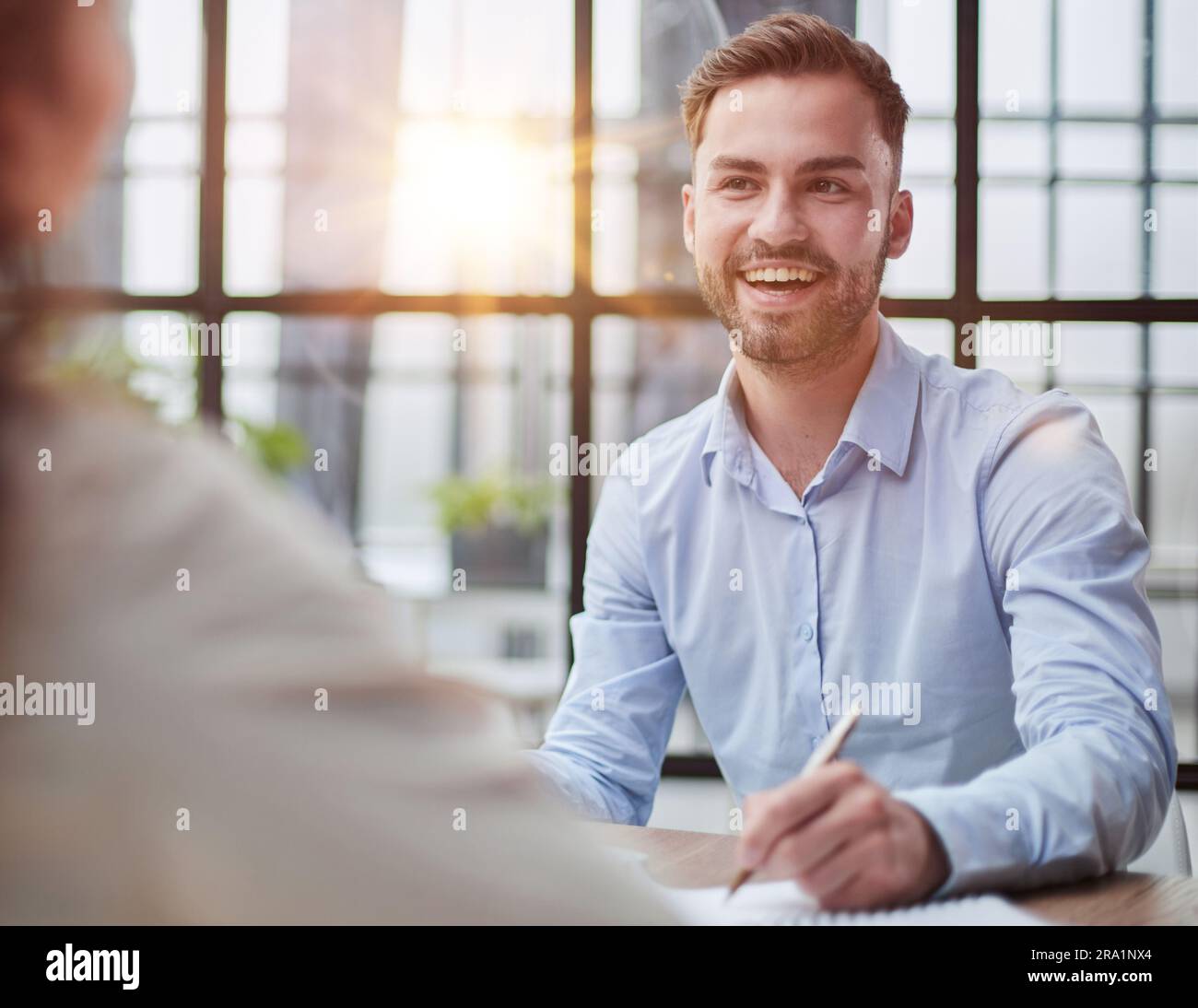 Handsome bearded man in a modern office Stock Photo