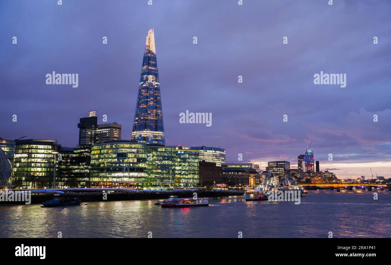 London, United Kingdom - November 04, 2017: Night view of Thames River coast, Illuminated London city buildings Stock Photo
