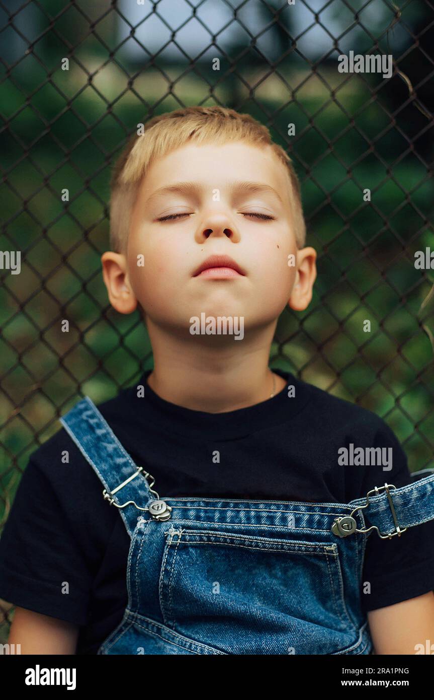 Portrait of a little boy outdoors Stock Photo - Alamy