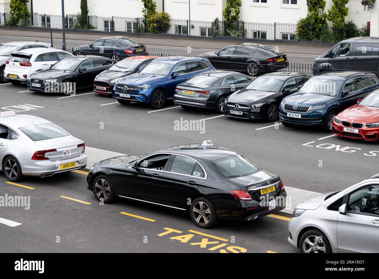 Taxis and cars parked at Leamington Spa railway station, Warwickshire