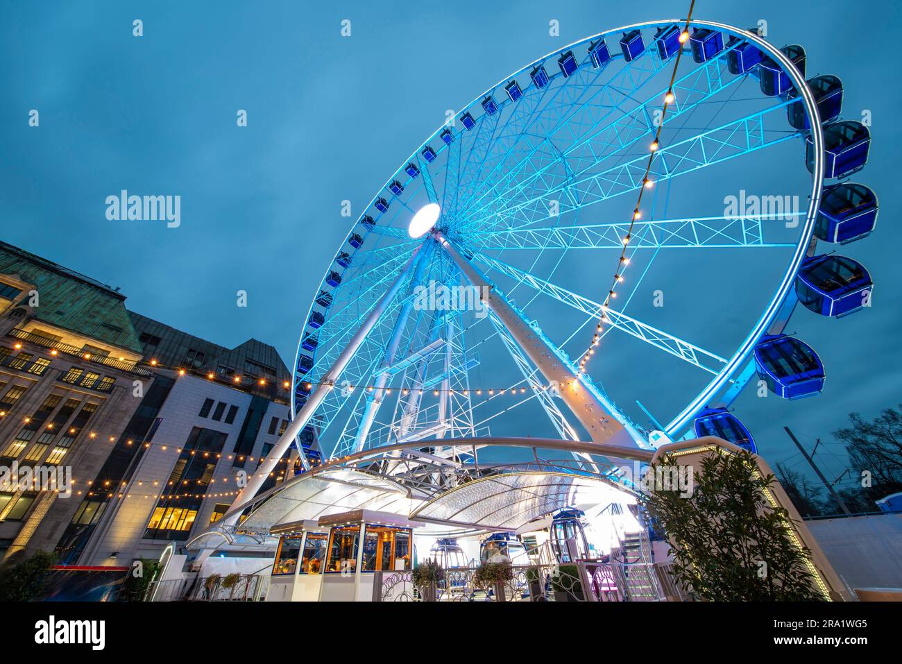 Giant wheel at Koenigsallee by sunset, Dusseldorf, Germany Stock Photo
