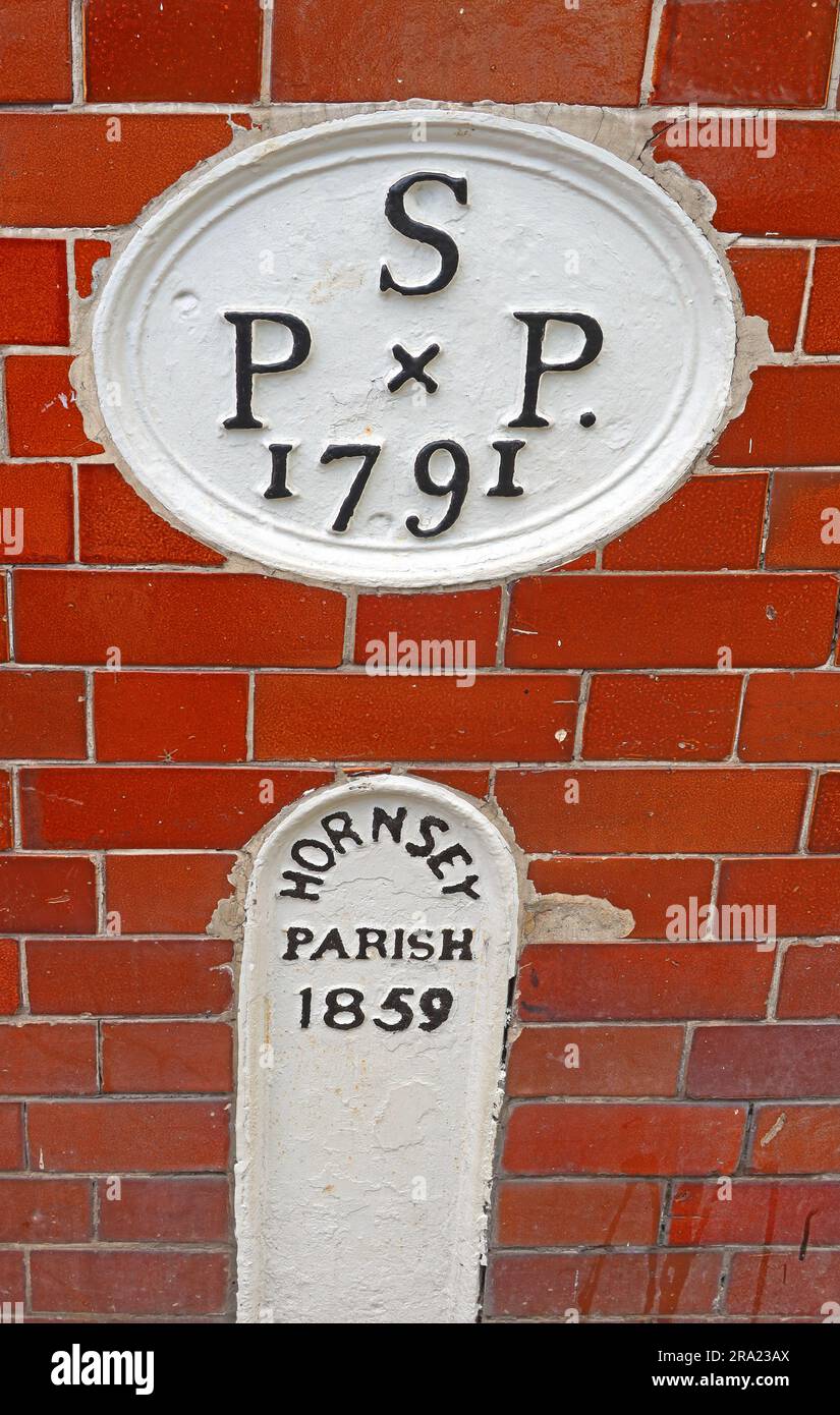 Historic Hornsey Parish boundary marker dated 1859 & S PxP 1791 on Highgate High Street, Highgate, north London, N6 5JG Stock Photo