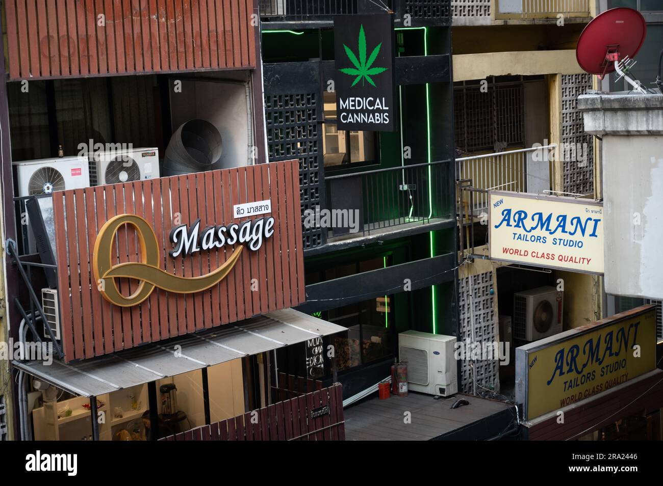Massage parlour next to a legal Medical Cannabis Shop in Bangkok, Thailand Stock Photo