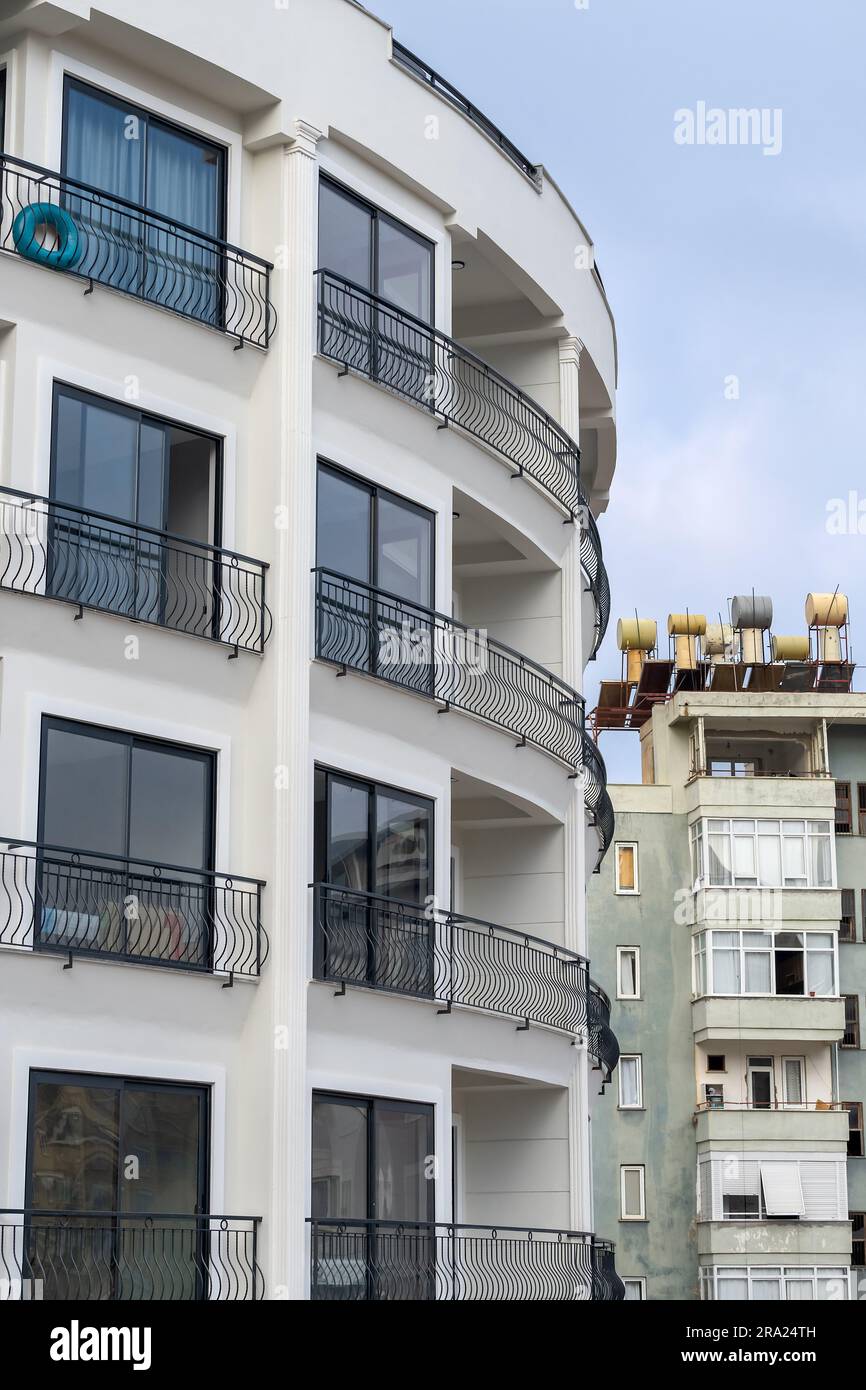 View of New luxury residential building with metal railings. In the background ...