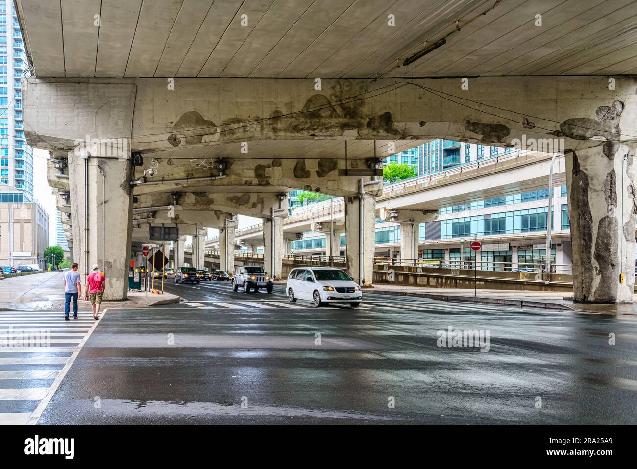 Cars driving. The state of disrepair of the Gardiner Expressway. Point of view below the elevated urban road. Stock Photo