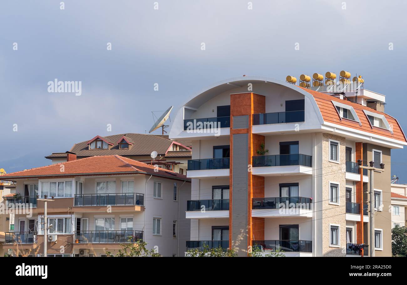 Picture of New residential building with solar water heaters on the roof. Urban ...