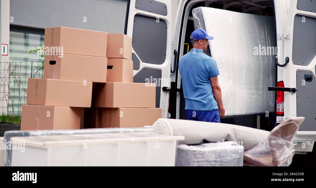 Mattress Delivery Truck. Movers Transporting And Shipping Stock Photo