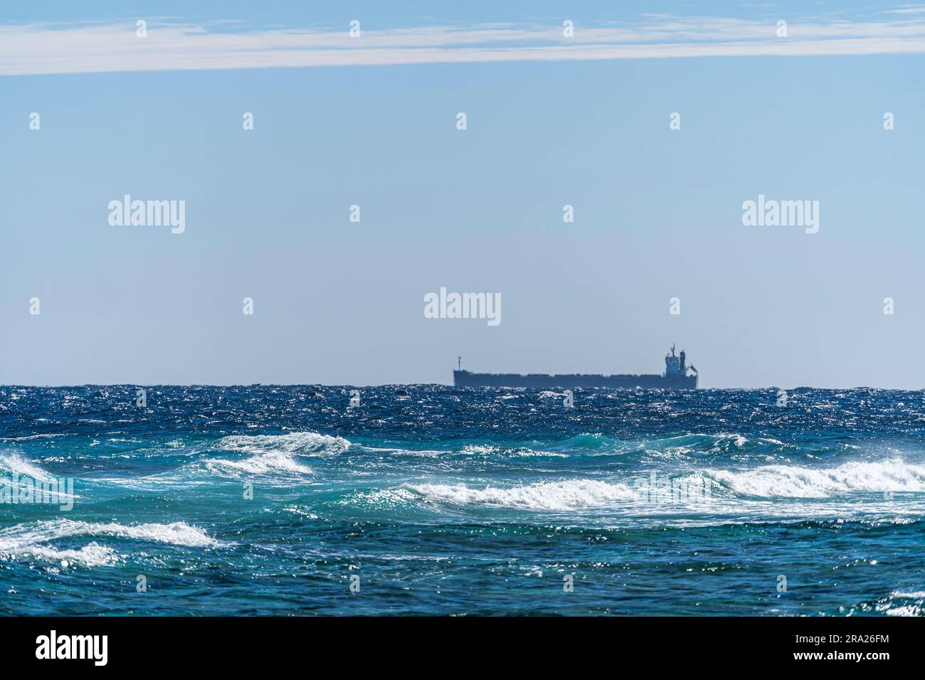 Large ship passing Lady Elliot Island, Great Barrier Reef, Queensland Australia Stock Photo