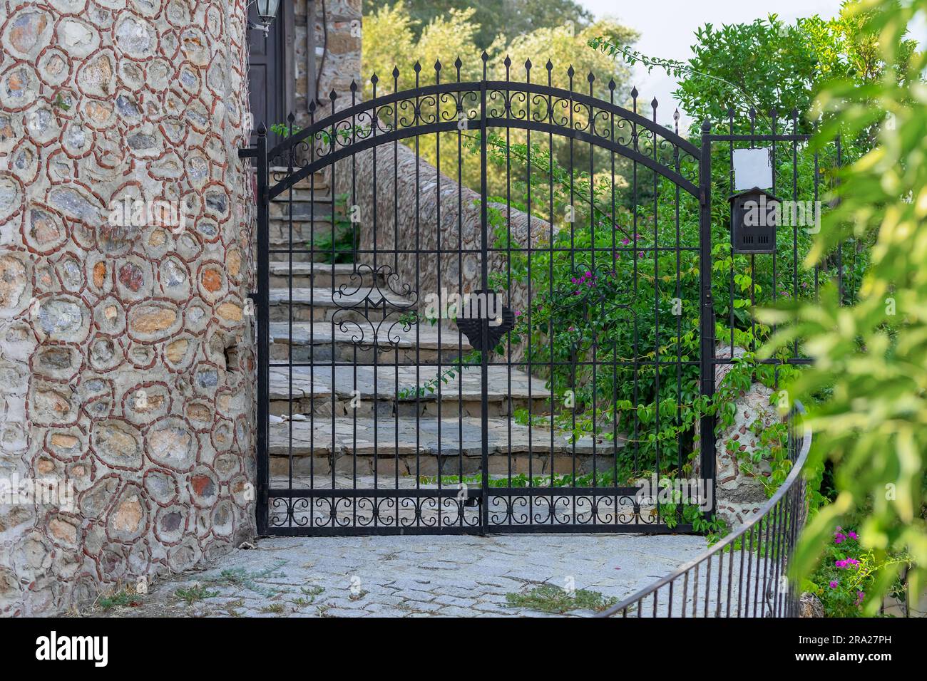 The gates are metal. Entrance to a private area. Country estate Stock ...