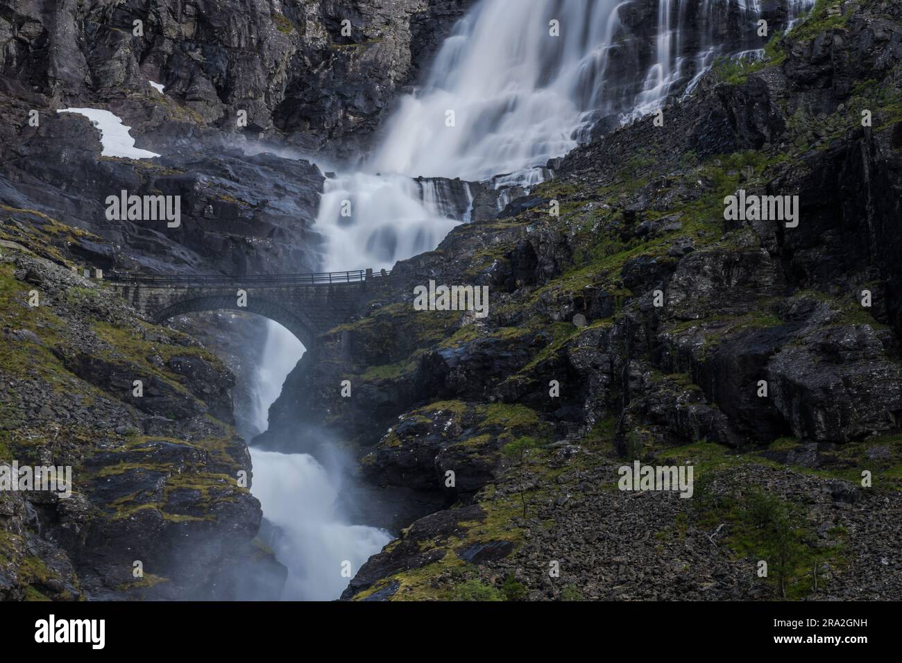 Trollstigen Road In Norway With Stone Bridge Waterfall And Dramatic Cliffs. Scenic Norwegian Destinations. Stock Photo