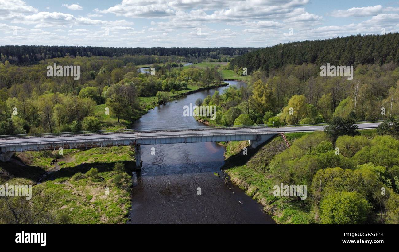 Aerial view of a river with a bridge spanning its width Stock Photo