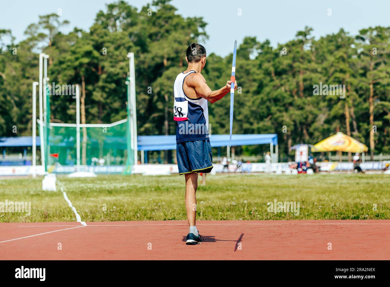 para athlete without leg with crutch javelin throw at athletics championships, summer sports games Stock Photo