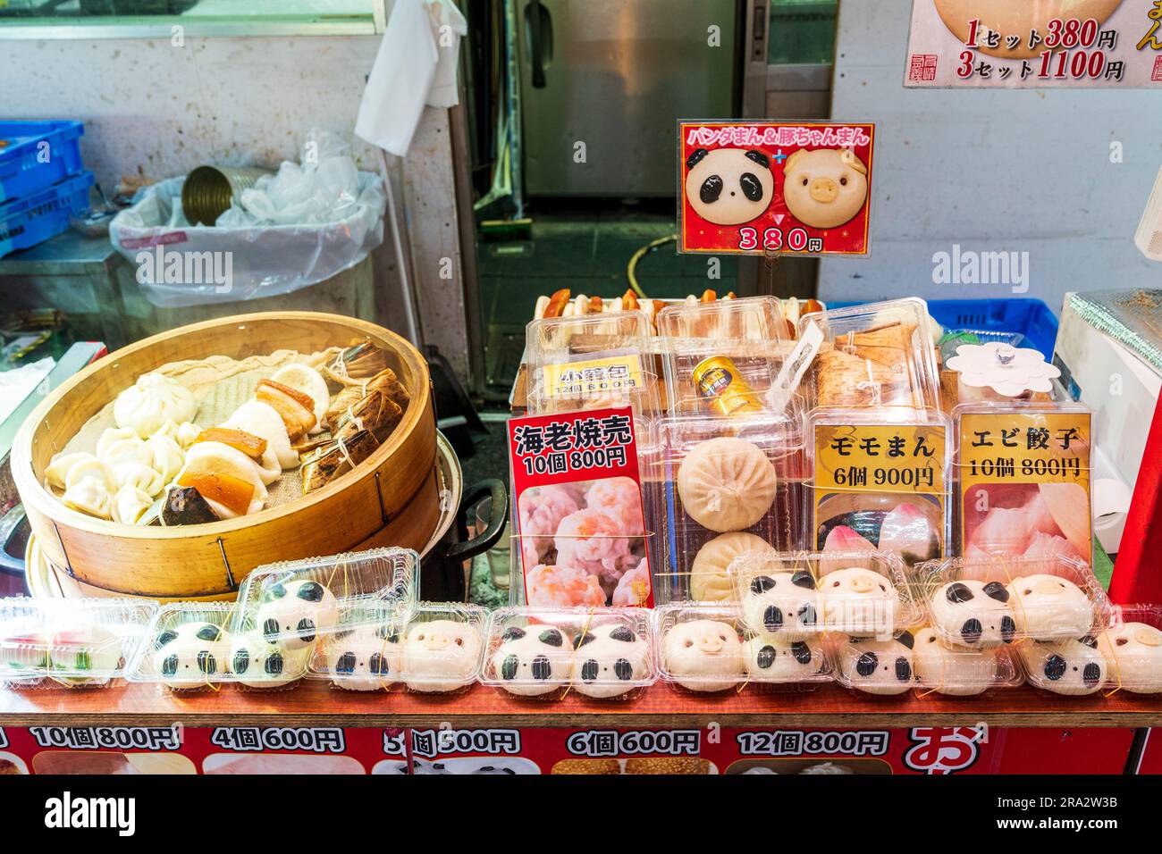 Steamed dumplings and buns cooking next to packets of Pandaman and