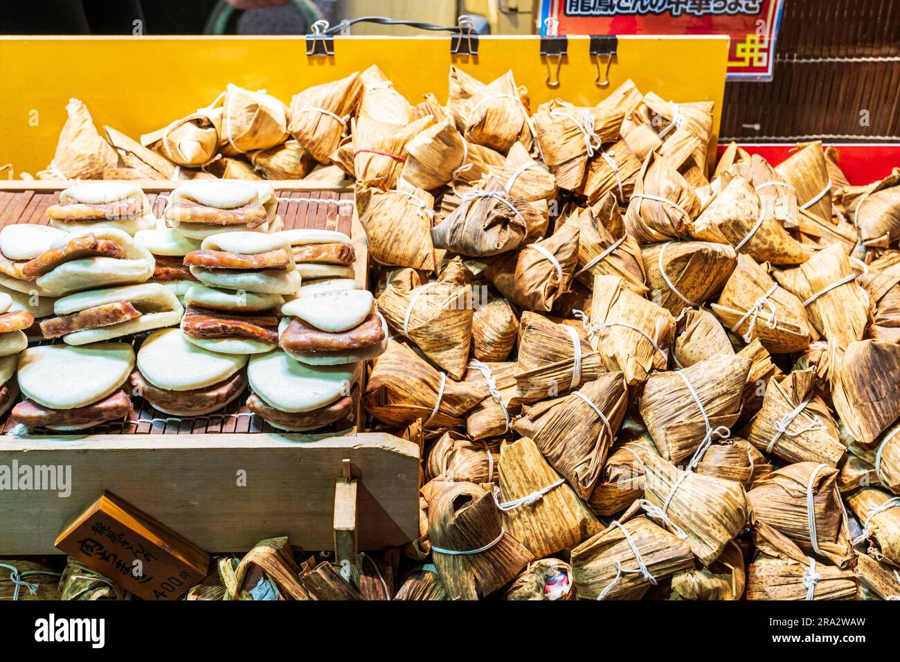Selection of various Chinese hot food on trays on a stall in Chinatown