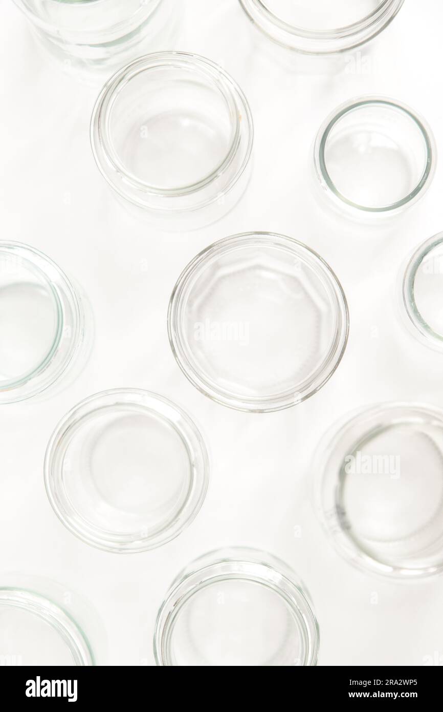 Assorted set of glass containers without lids on white background
