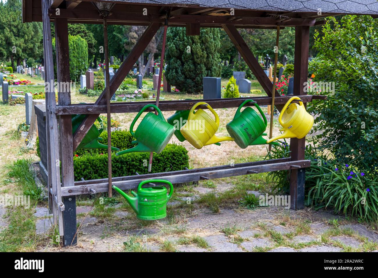 Collection point for watering cans at the Trinitatis cemetery in Dresden, Germany Stock Photo