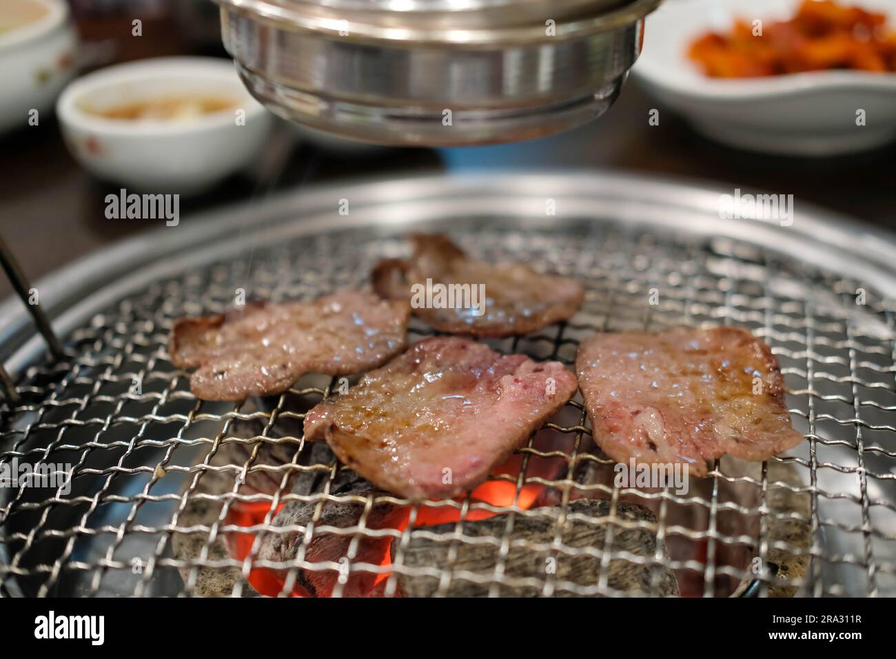 Korean Style Barbecue Grill BBQ rare beef tongue meat with soft focus