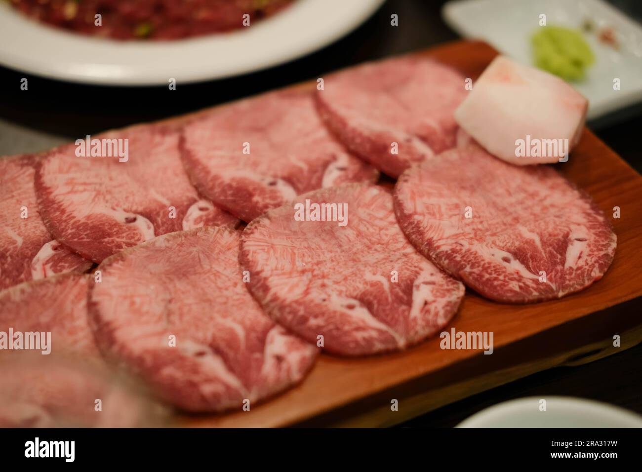 Korean Style Barbecue Grill BBQ rare beef tongue meat with soft focus