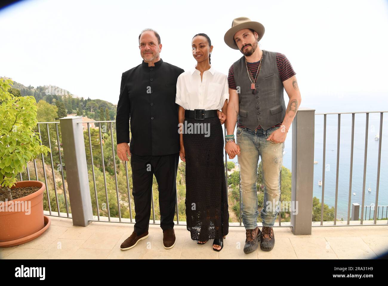 Taormina : 69th Film Festival . Photocall The absence of eden . In the photo : Barrett Wismann, Zoe Saldana and Marco Perego Stock Photo
