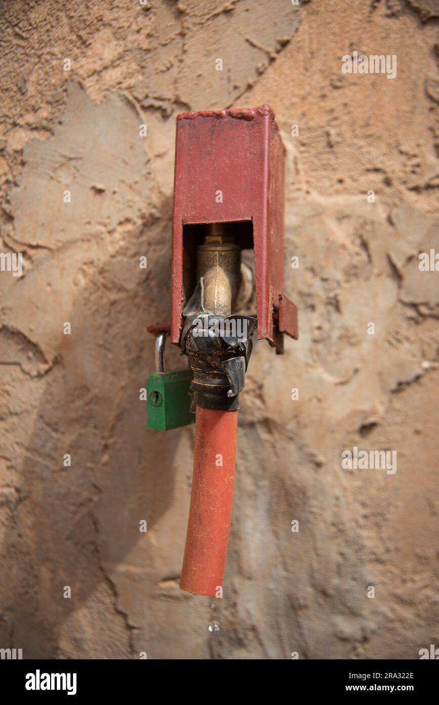 Nicolas Remene / Le Pictorium -  Prepaid meters and mobile application in Niger -  29/5/2020  -  Niger / Niamey / Niamey  -  In the Goudel Maourey district of Niamey in Niger, 'smart' water meters have been installed, enabling each family to pay for its water consumption as it occurs, using a mobile phone and an application. This type of prepaid meter allows local residents to regulate their consumption according to their income. This makes it possible to offer access to drinking water at home at a lower cost, with a prepayment system adapted to the irregular incomes of a large proportion of d Stock Photo