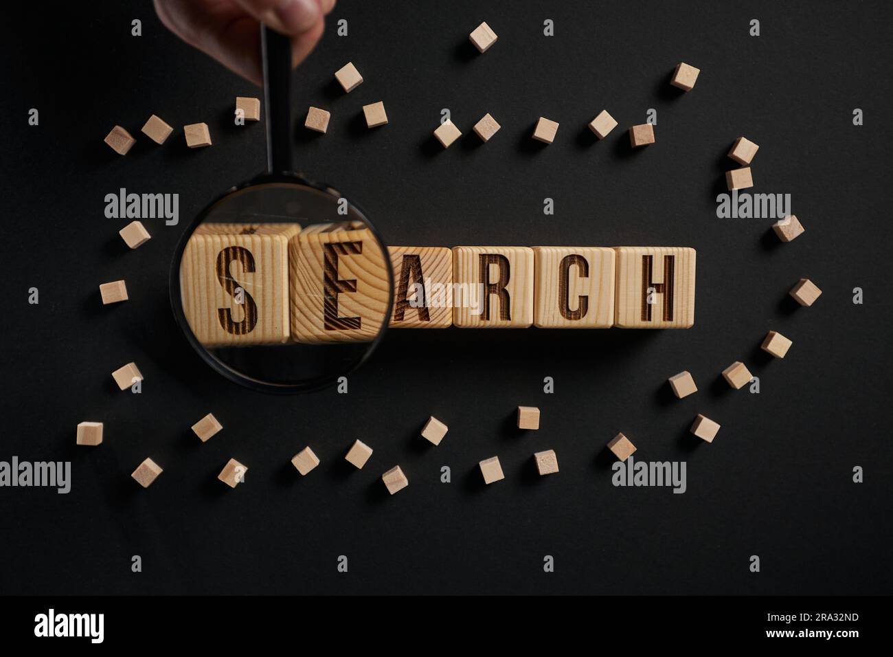 The word search with a loupe on a black background Stock Photo Alamy