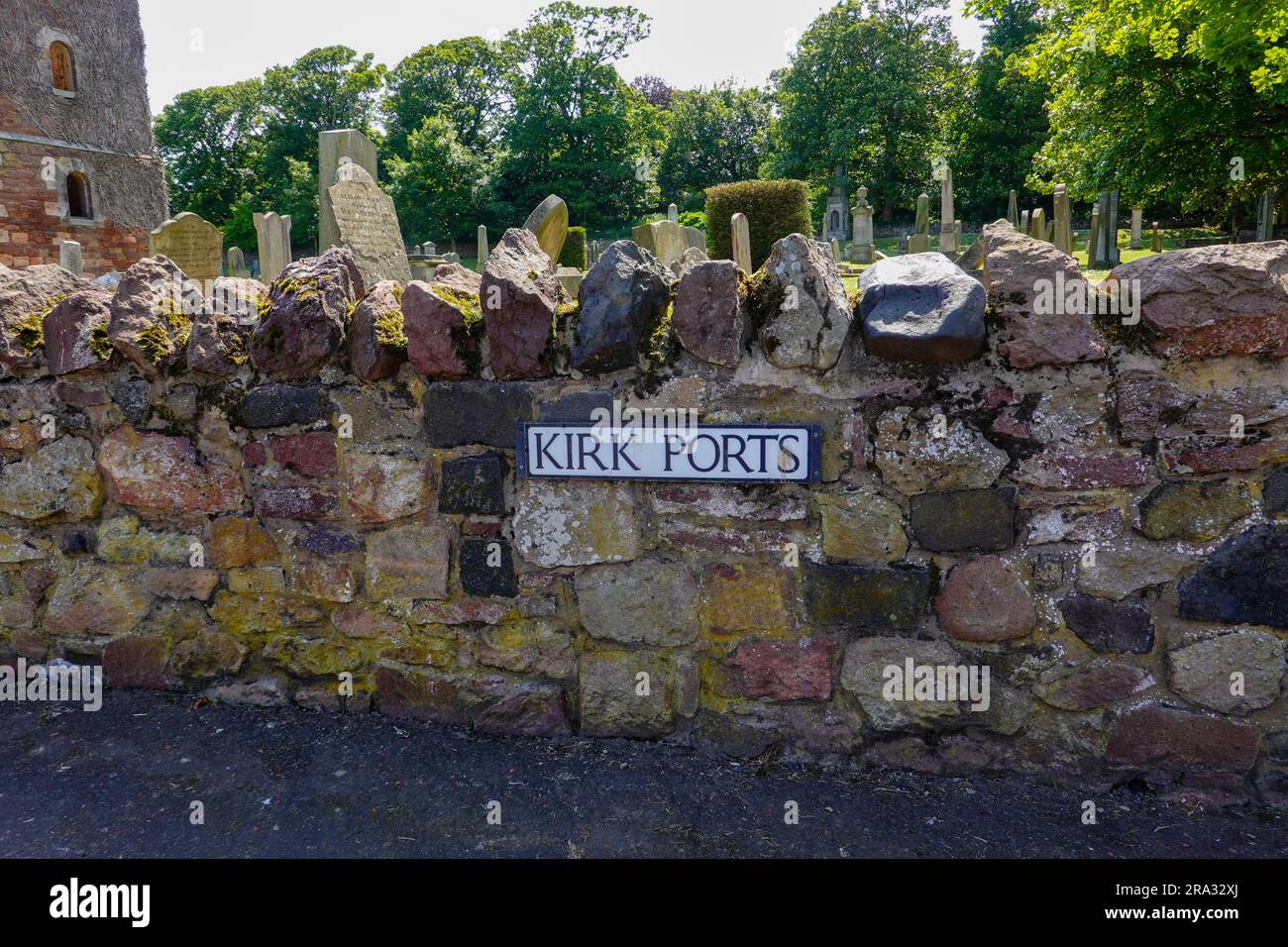 Kirk Ports, rock wall with old, crooked tombstones, old St. Andrews