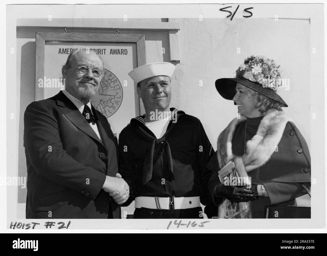 Burl Ives with His Wife and Stepson, Seaman Recruit Robert Grossman. Actor-balladeer Burl Ives and his wife pause with their sone, Seaman Recruit Robert Grossman, following Friday's Recruit Brigade Review during which Ives was a guest of honor and Grossman graduated from Company 057.. Stock Photo