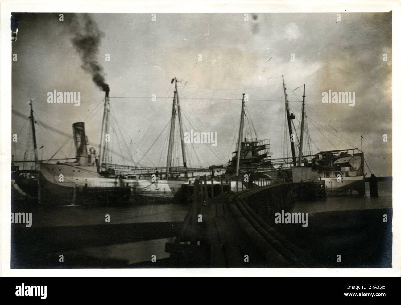 Photograph of the Port View of the Bargev Socony #82. Photograph Of Port View Only. August 30, 1918. Photograph Of Bargev Socony #82. Nationality: - American. Tonnage Net '2070. Captain: - H. Sorensen. Owners: - Std. Oil Co. Where From: - Wilmington, N. C. Destination: - Tampico, Mexico. Where Photographed: - Charleston, S. C. Sixth Naval District. By Whom Photographed: - J. B. Dearborn. Date: - August 10th., 1918. Where Camouflaged: - New York, N. Y. Date: - March 1918. There Was No Bridge & The Starboard Was Unobtainable.. 1918-08-30T00:00:00. Stock Photo