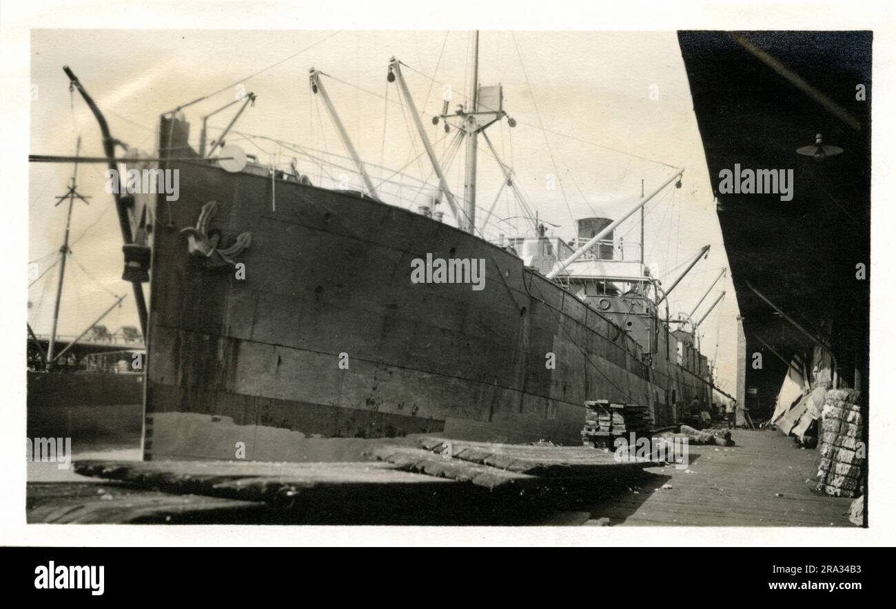 Photograph of the Port View of the SS Gretavale. Photograph Of Port View. May 18th., 1918. Photograph of S. S.; Gretavale: - Nationality; - British, Tonnage-5388. Captain;- James Morris. Owners; -Donaldson Line Ltd. Glasgoo Glasgow, Eng. Where from: - Manchester, Eng. Dest., Liverpool, England. Where photographed: - Savannah, Ga. Sixth Naval District. By whom photographed: - J. Boyd Dearborn. Date photographed: - May 11th., 1918. Started camouflage, Fore side of bridge finished, port & starboard not camouflaged. Where camouflaged: -England. Date camouflaged: - Could not remain long enough to f Stock Photo