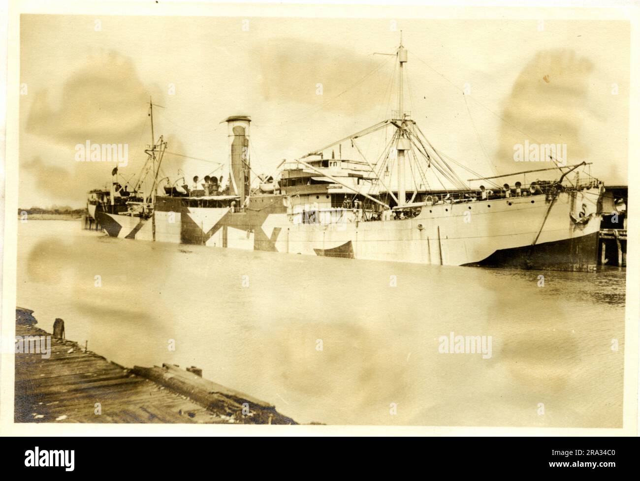 Photograph of the Starboard View of the SS Architect. Starboard View. Date: - July 29, 1918. Photograph Of; - S. S. Architect. Nationality: - British. Tonnage: -6736. Captain: - W. N. Rushforth. Owners: - T. & J. Harrison. Where From: - Plymouth, Eng. Destination: - Liverpool, Eng. Bordeux Bordeaux, France.? Where Photographed: - Savannah, GA. Sixth Naval District. By Whom Photographed: - J. B. Dearborn. Date Photographed: - July 12th., 1918. Where Camouflaged: - West Hartlepool, Eng. Date: - June 7th., 1918. By Whom: - Gray Shipbuilding Co. Type Of Ship: - Well Deck. Beam: 52 ft., Length: -41 Stock Photo