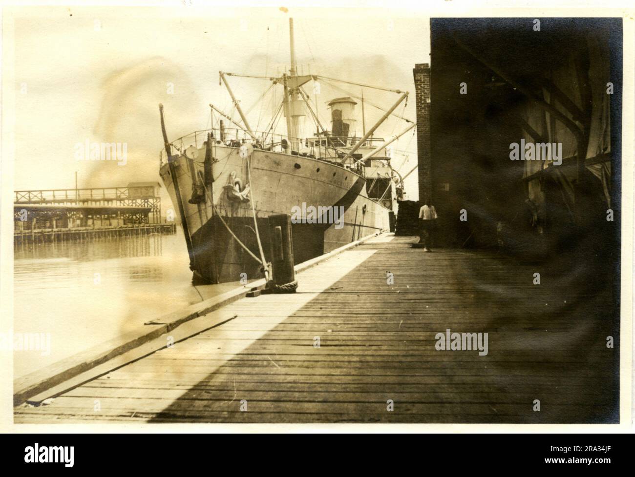 Photograph of the Port View of the SS Architect. Port View. Date: - July 29, 1918. Photograph Of; - S. S. Architect. Nationality: - British. Tonnage: -6736. Captain: - W. N. Rushforth. Owners: - T. & J. Harrison. Where From: - Plymouth, Eng. Destination: - Liverpool, Eng. Bordeux Bordeaux, France.? Where Photographed: - Savannah, GA. Sixth Naval District. By Whom Photographed: - J. B. Dearborn. Date Photographed: - July 12th., 1918. Where Camouflaged: - West Hartlepool, Eng. Date: - June 7th., 1918. By Whom: - Gray Shipbuilding Co. Type Of Ship: - Well Deck. Beam: 52 ft., Length: -410 ft., Dra Stock Photo