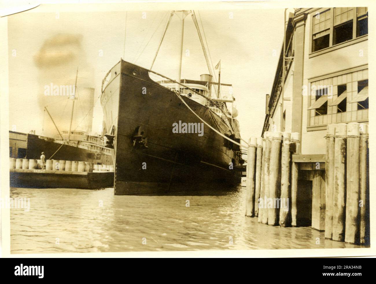 Photograph of the Port View of the SS City of St. Louis. Port View. Date: - July 19, 1918. Photograph Of: - S. S. City Of St Louis. Nationality: - American. Tonnage: - 5425. Captain: - L. Dalzell. Owners: - Ocean S. S. Co. Where From: - Boston, Mass. Destination: - Boston, Mass. Where Photographed: - Savannah, GA. Sixth Naval District. By Whom Photographed: - J. B. Dearborn. Date Photographed: - July 13th., 1918.. 1918-07-13T00:00:00. Stock Photo