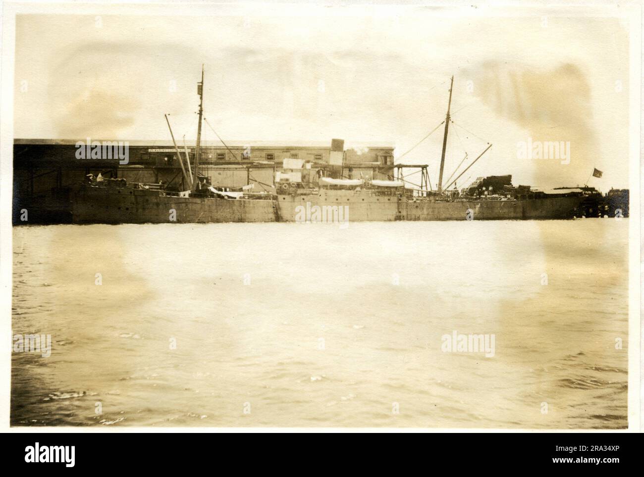 Photograph of the Port View of the SS Sterling. Photograph Of Port View. Date- May 28th., 1918. Photograph of, S. S. Sterling: - Nationality- American, (Originally British) Tonnage Displacement - 5663; Net 2000. Captain: - Lt. Comdr. O. A. Michaelsen. Owners U. S. Government Government. Where from: - Philadelphia, Penn. Dest. Danish West Indies Islands. Where photographed: - Charleston, S. C. Sixth Naval District. By whom: - J. B. Dearborn. Date photographed: - May 23rd., 1918.. 1918-05-23T00:00:00. Stock Photo