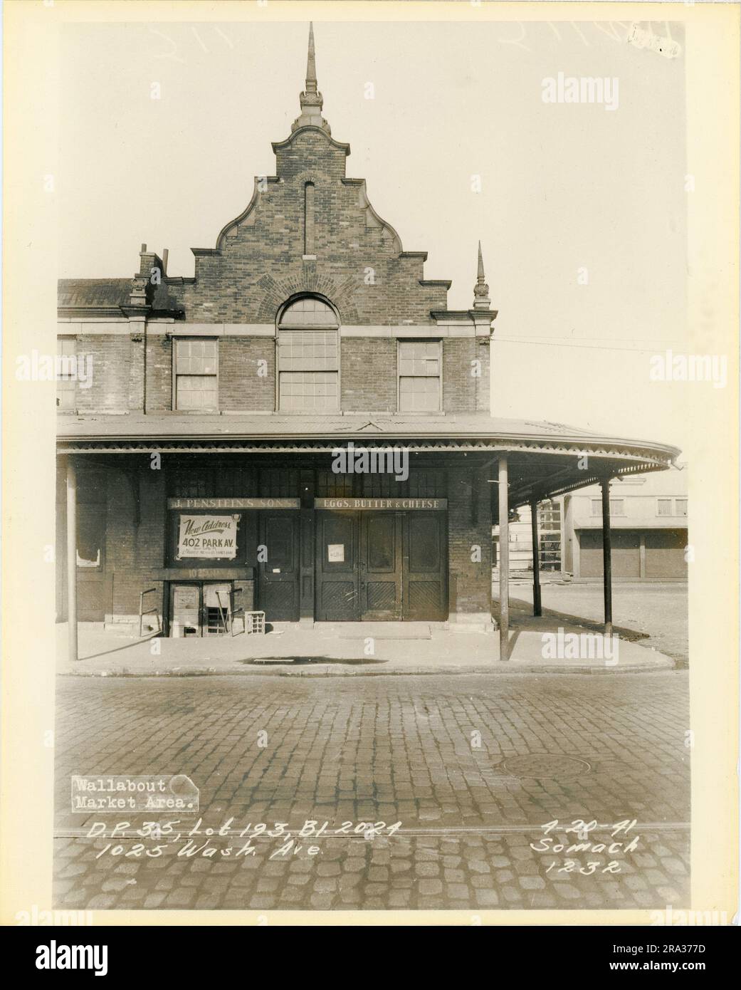 Photograph Of Exterior Of Lot 193 Bl 2024 1025 Wash Ave Depicts   Photograph Of Exterior Of Lot 193 Bl 2024 1025 Wash Ave Depicts Exterior Of Building With Sign For J Pensteins Sons And Sign Noting New Address 2RA377D 