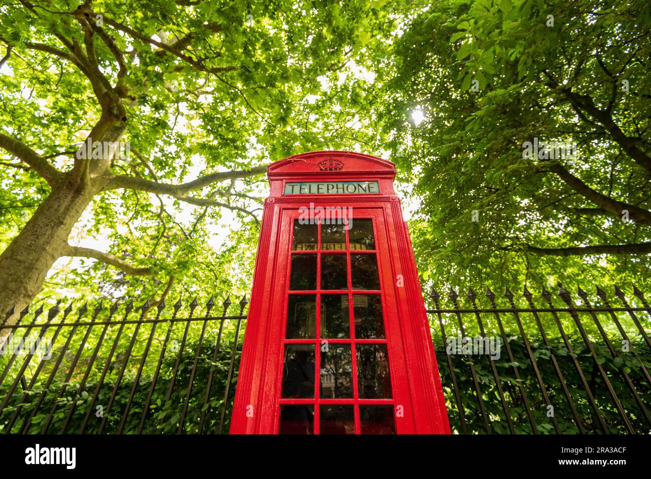 London's classic red telephone booth, red telephone box, on a city