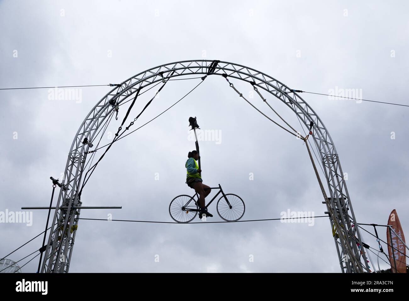 Coventry, UK. 30th June, 2023. Colombian aerial acrobat Andres Meneses rehearses for his bicycle performance on the 15ft high wire at Coventry's Godiva Festival. The festival begins on Friday June 30th and goes on until late Sunday July 2nd. Credit: Peter Lopeman/Alamy Live News Stock Photo