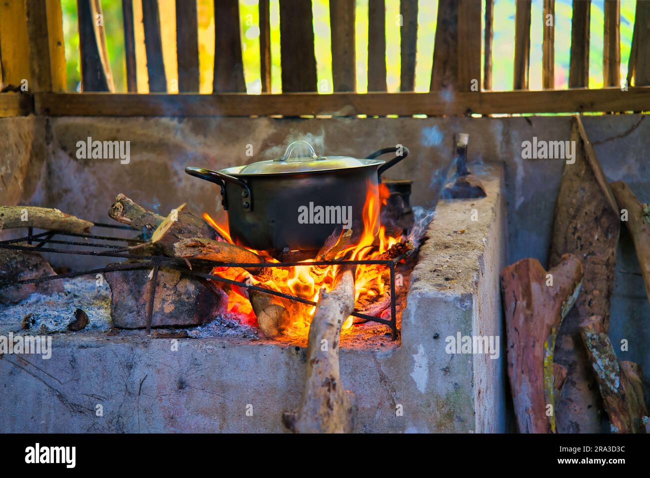 Authentic and traditional way of cooking the creole food in Seychelles, on  cast iron pot in direct wooden flames, Mahe Seychelles Stock Photo
