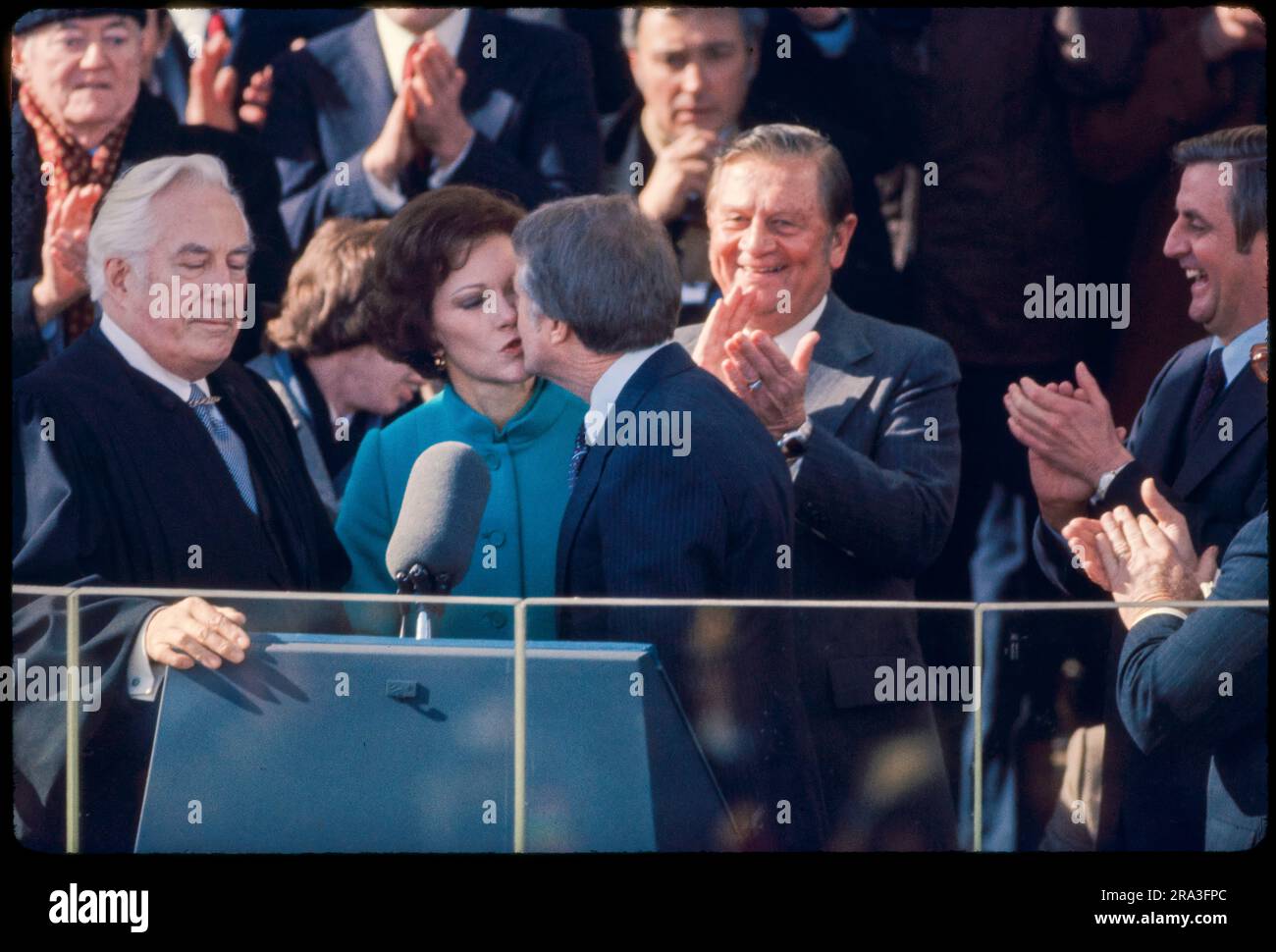 Jimmy Carter is sworn in as 39th President of the United States by Supreme Court Chief Justice Warren Burger. By Carter's side is his wife, Rosalynn and Vice President Walter Mondale. Photograph by Bernard Gotfryd Stock Photo