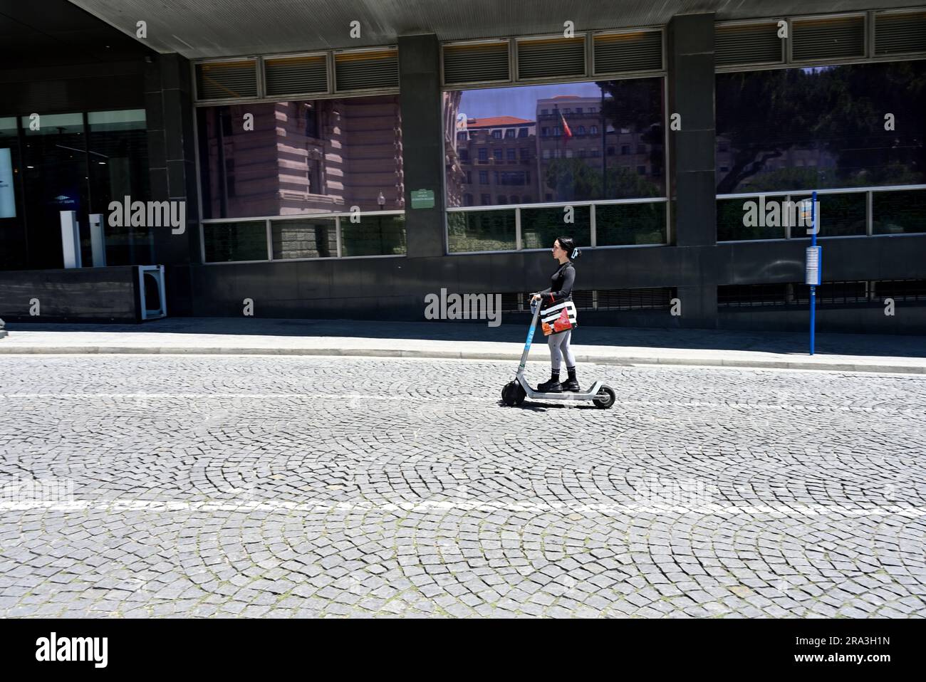Woman on an electric scooter hi-res stock photography and images - Alamy