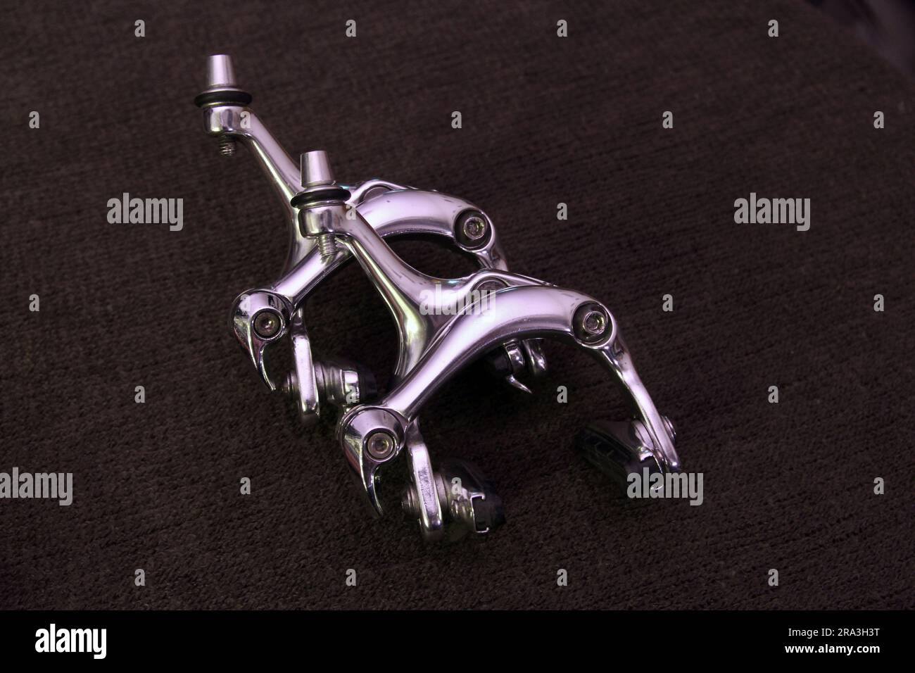 bike parts (brakes, cassette, hub) brand new shiny silver chrome on dark background (bicycle maintenance, repair) cycling Stock Photo