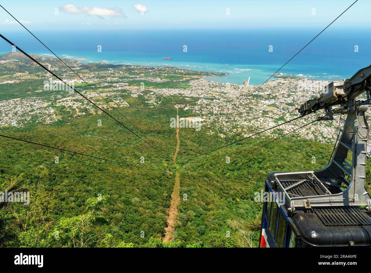 View of Puerto Plata, forest, ocean, and the cable car from the top of Mount Isabel de Torres