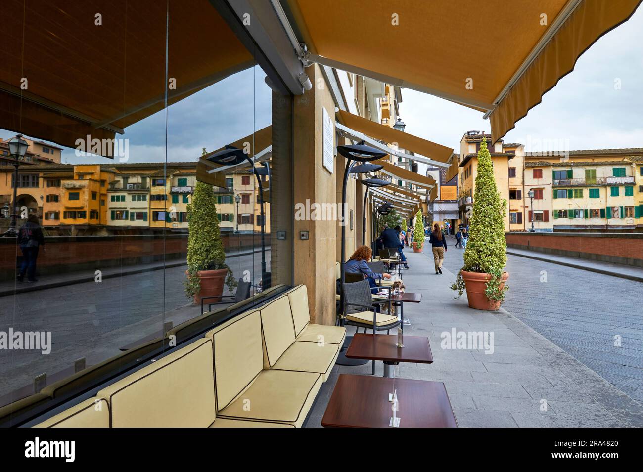 Walking along Arno river promenade in the city center of Florence, Italy Stock Photo