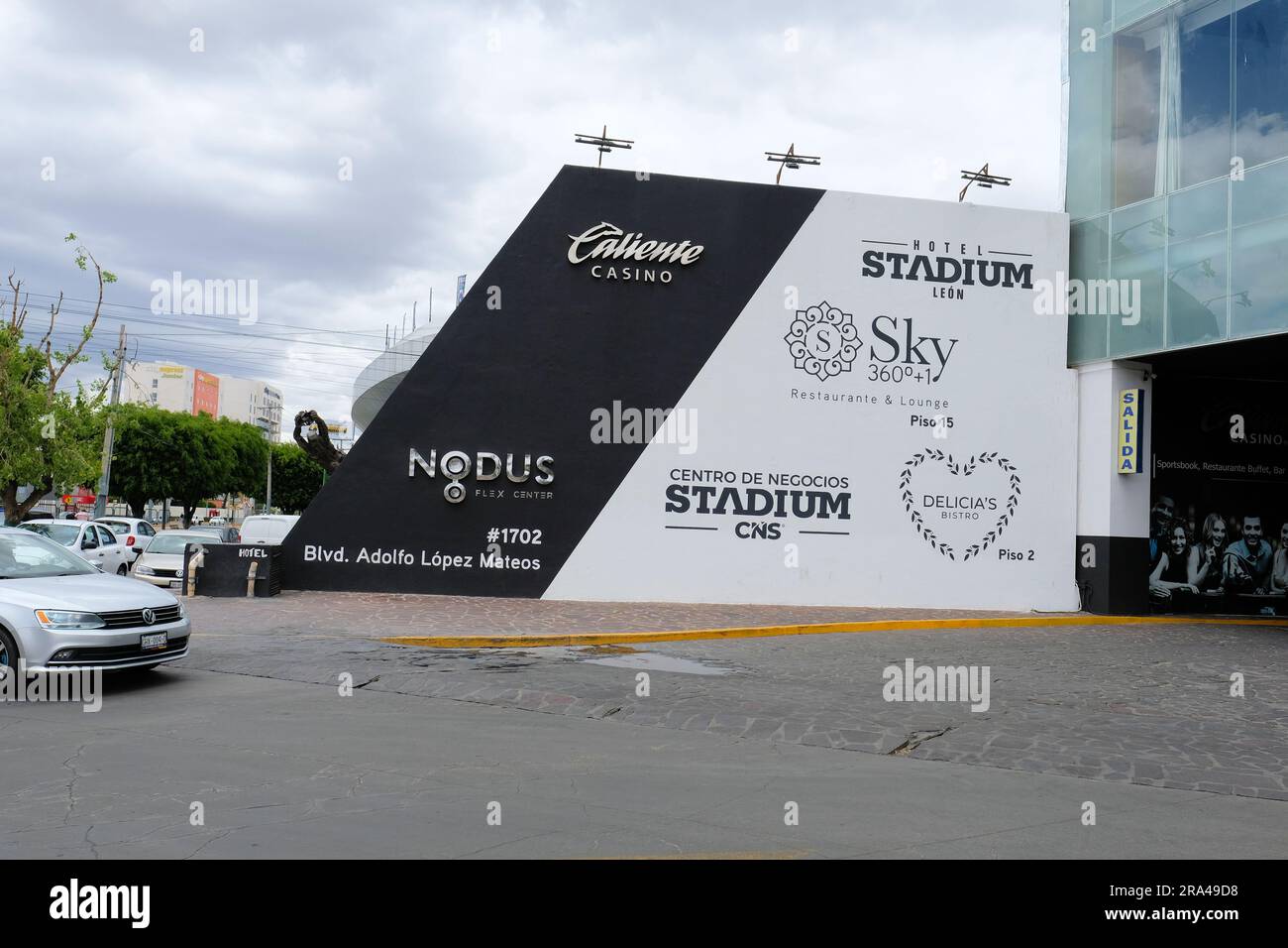 Wall near the Hotel Plaza Stadium and Caliente Casino in Leon, Guanajuato, Mexico; lodging and gambling location near Leon Stadium; advertising mural. Stock Photo