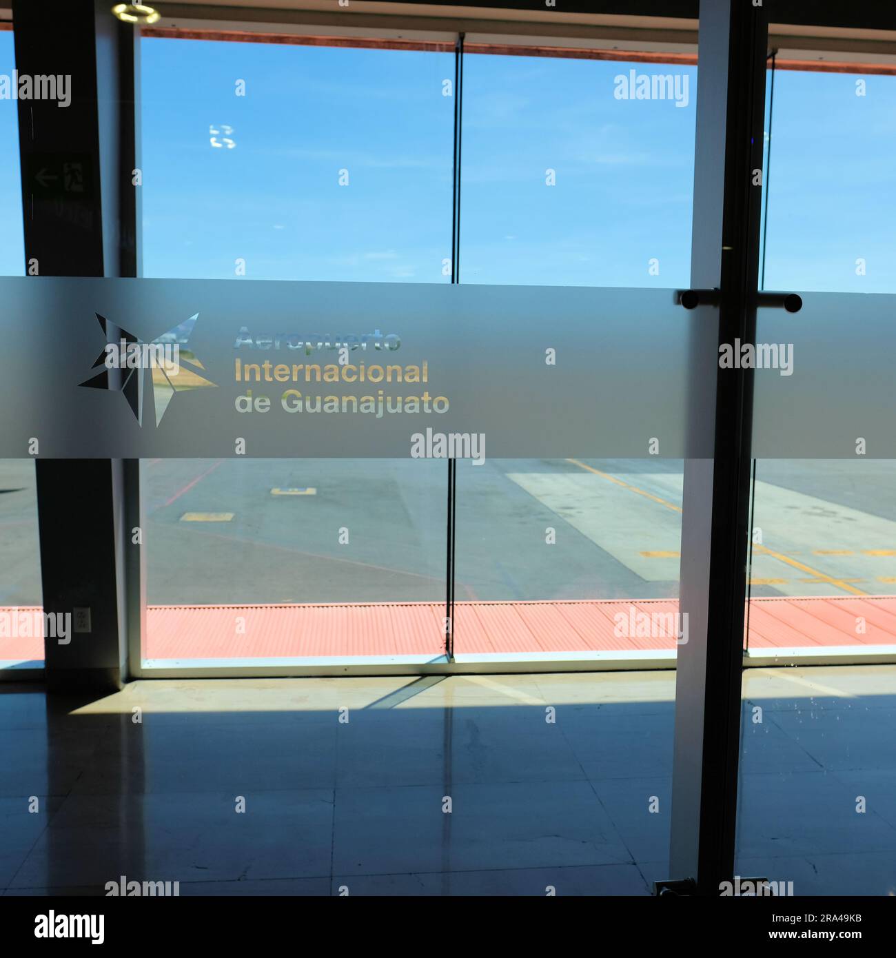 Glass etching with logo and name of Aeropuerto Internacional del Bajio, outside of Leon, Guanajuato in the town of Silao; Bajio International Airport. Stock Photo